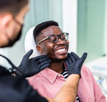 A man smiling after orthodontic treatment