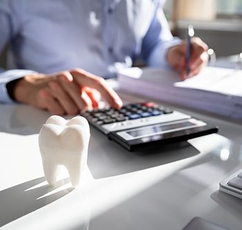 Person budgeting for the cost of dental care