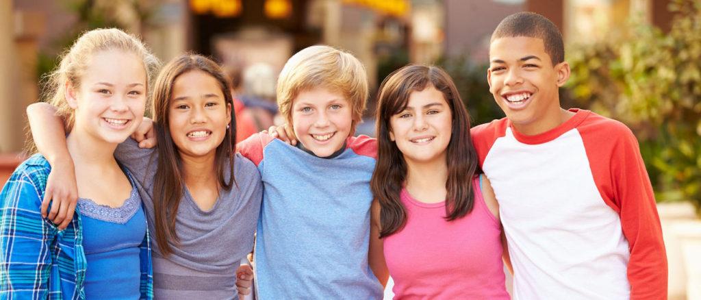 Teens smiling outdoors